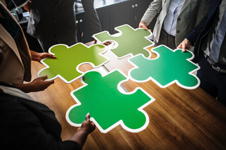 green connectivity metaphor with jigsaw pieces